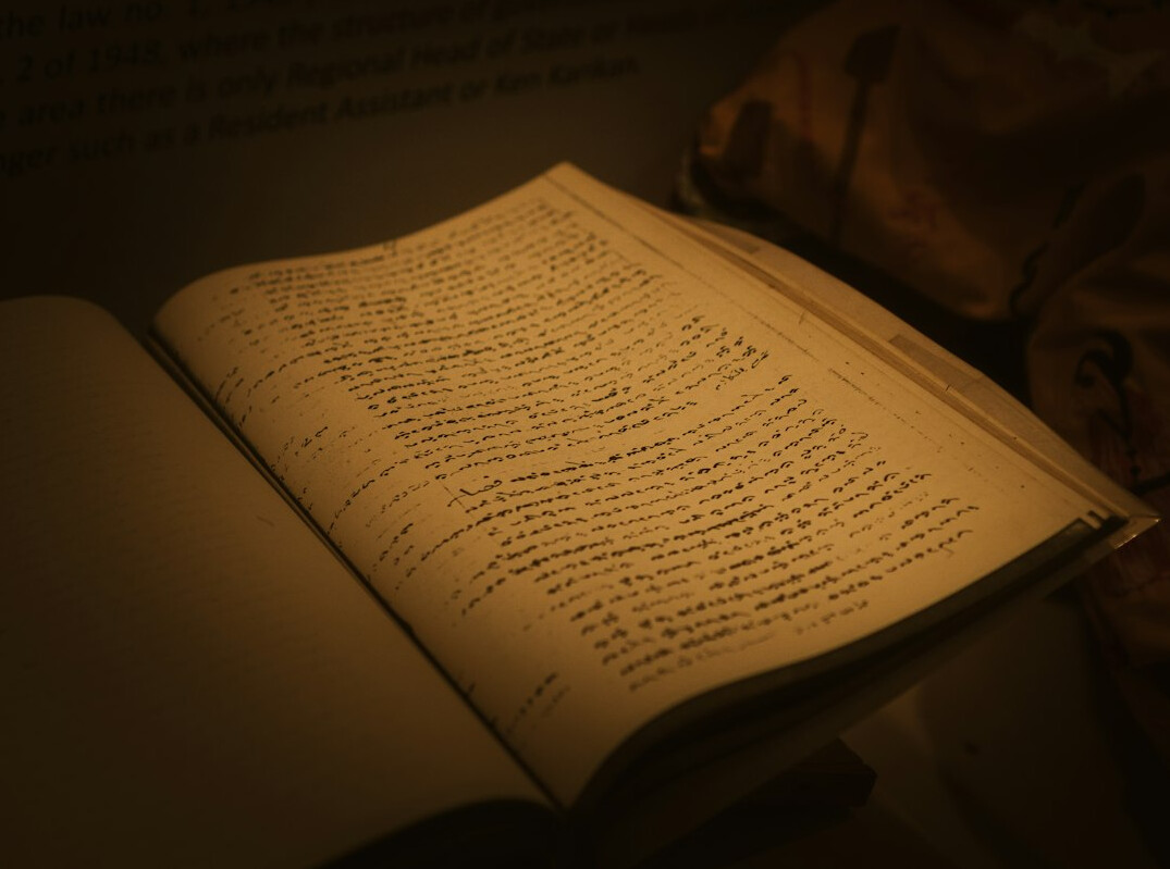 detective reading old book
