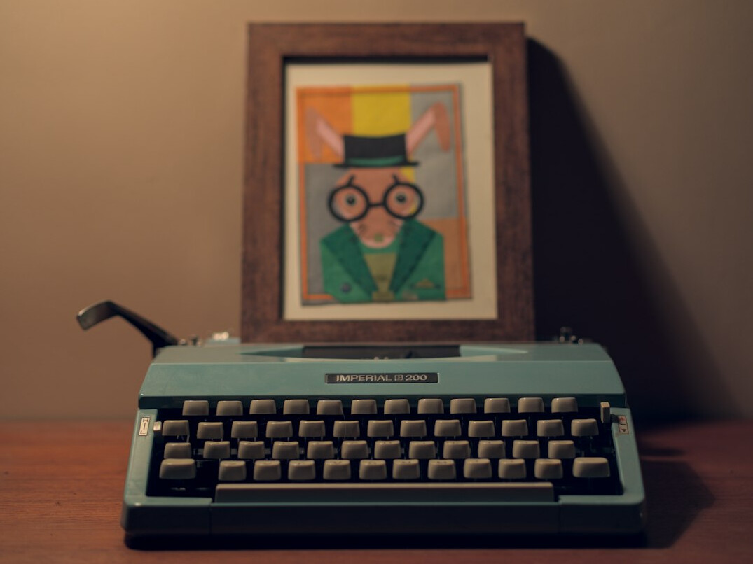 Vintage typewriter with a sheet of paper on a writer's desk